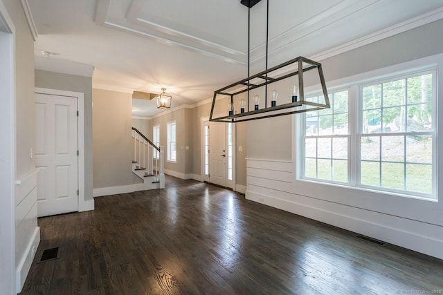 interior space featuring stairway, visible vents, dark wood-style flooring, and ornamental molding