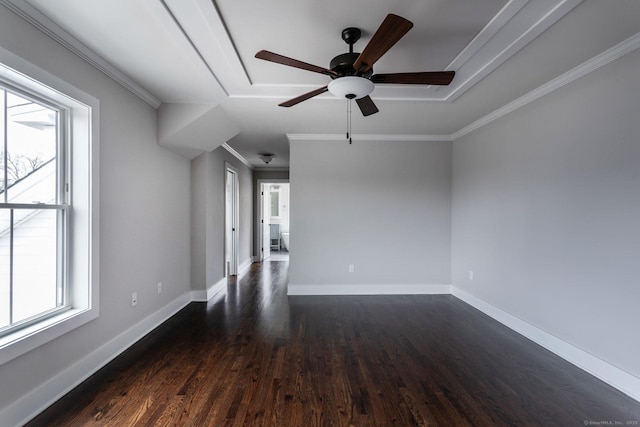 unfurnished room featuring crown molding, ceiling fan, plenty of natural light, and dark hardwood / wood-style flooring