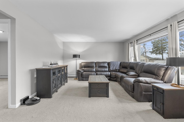 living room with a baseboard heating unit and light carpet