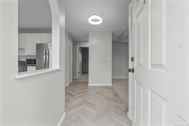 hallway with light parquet flooring