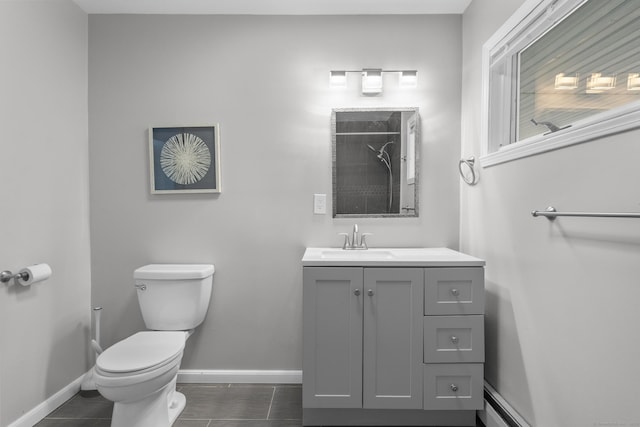 bathroom featuring vanity, a shower, and toilet