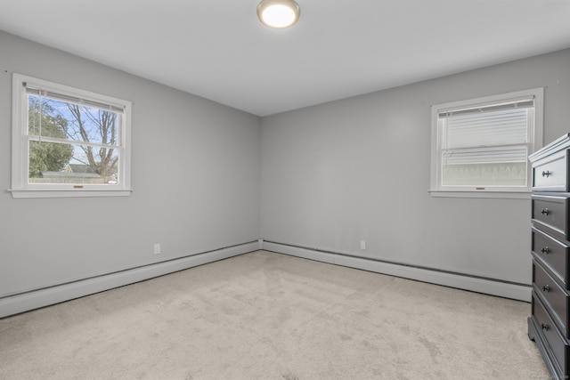 unfurnished room with light carpet