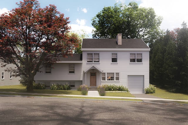 view of front of home featuring a garage and a front lawn