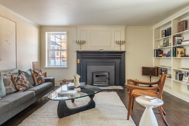 living room featuring dark wood-type flooring and ornamental molding