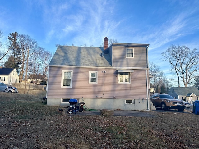 back of house with a patio