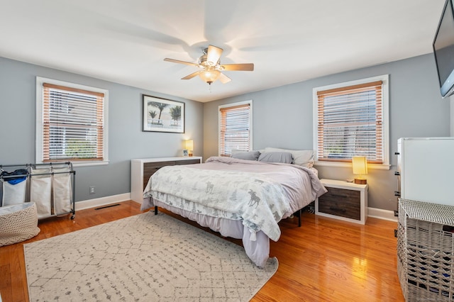 bedroom with hardwood / wood-style flooring and ceiling fan