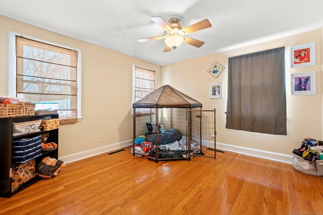 misc room featuring ceiling fan and light hardwood / wood-style floors