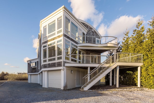 view of front of property featuring a garage and a deck