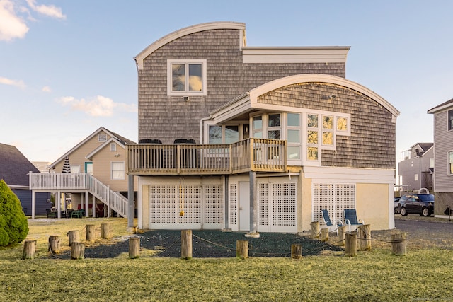 back of property featuring a yard and a deck