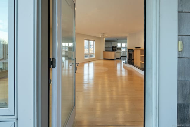 hall with light wood-type flooring