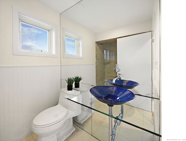 bathroom with tile patterned flooring and toilet