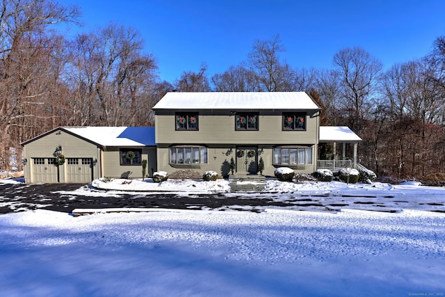 view of front of house with a garage and a porch