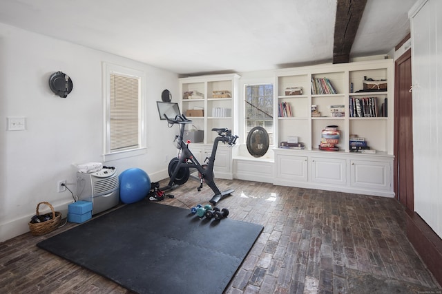 exercise area featuring brick floor