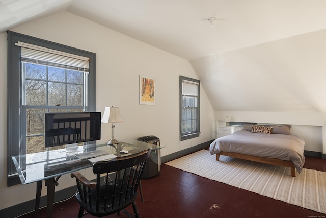 bedroom with vaulted ceiling and baseboards