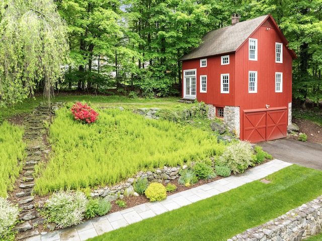 247 Mill Rd, New Canaan, CT 06840 - view of yard with driveway and an attached garage
