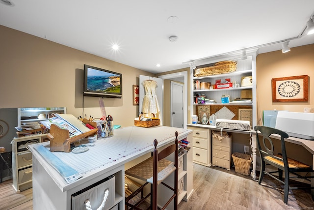 home office with light wood-style flooring, track lighting, and recessed lighting