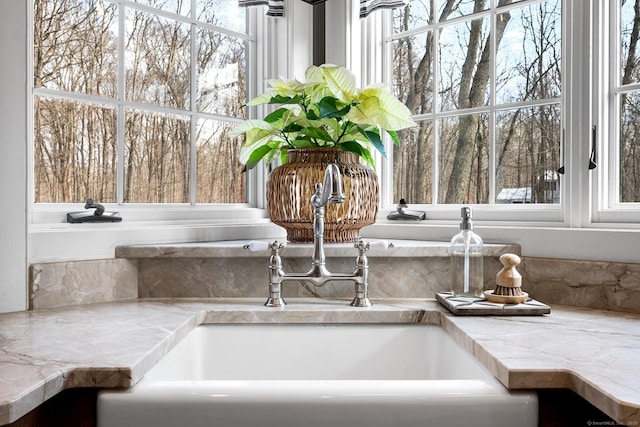 interior details with light countertops and a sink