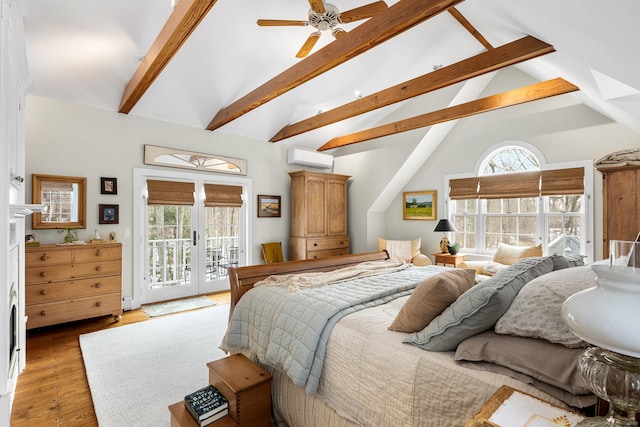 bedroom featuring lofted ceiling with beams, access to outside, french doors, light wood-type flooring, and a wall mounted air conditioner