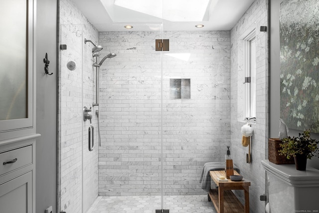 bathroom featuring a stall shower, toilet, and recessed lighting