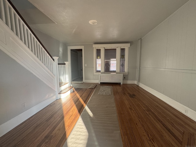 entryway featuring dark hardwood / wood-style floors and radiator