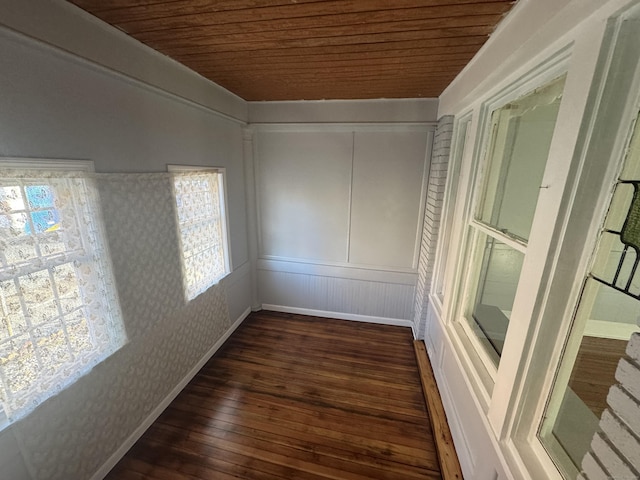 unfurnished sunroom featuring wood ceiling