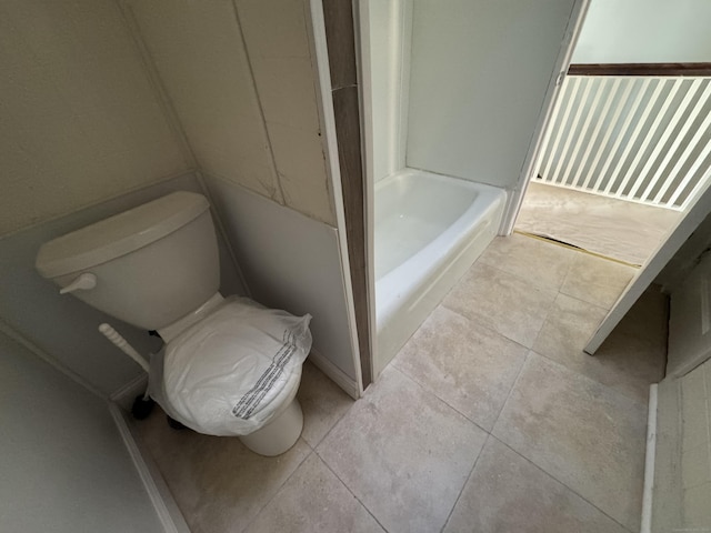 bathroom featuring tile patterned floors and toilet