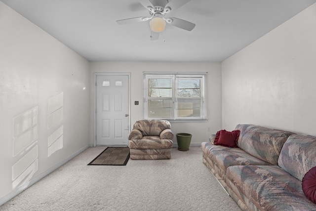 living room featuring ceiling fan and carpet