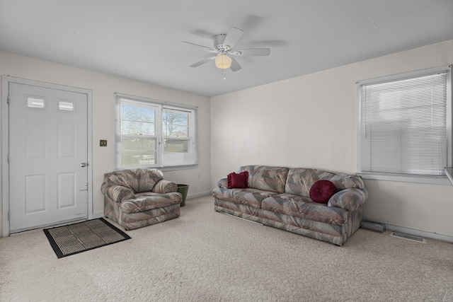 living room with carpet floors and ceiling fan