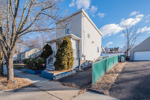 view of side of property with a garage