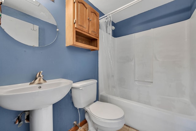 bathroom featuring shower / bath combination with curtain and toilet