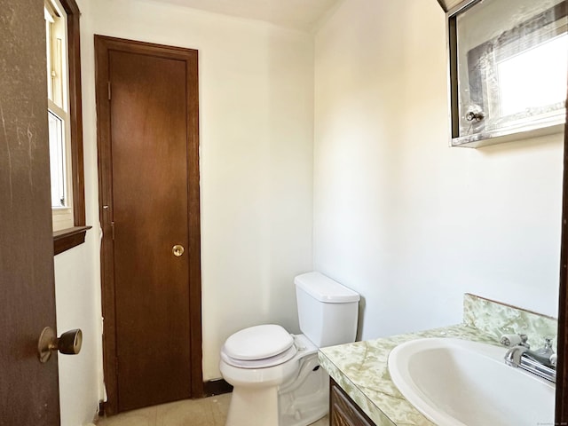 bathroom with toilet and vanity