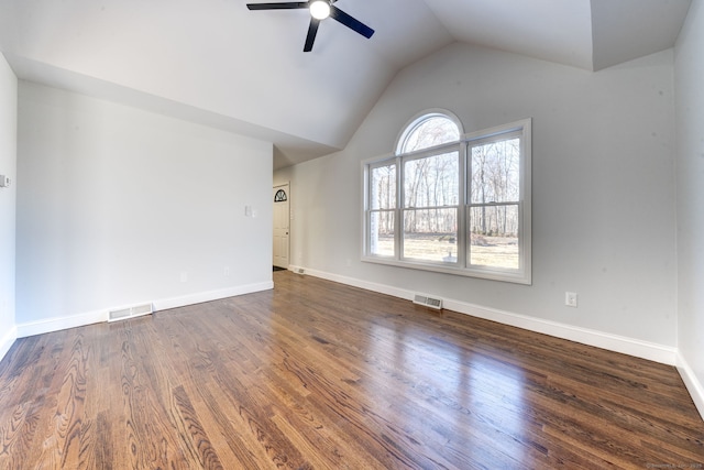 unfurnished room with dark wood-type flooring, ceiling fan, and vaulted ceiling