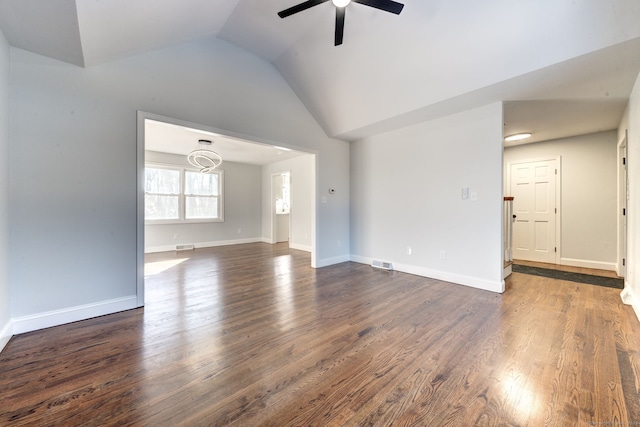 unfurnished living room with dark wood-type flooring, ceiling fan, and vaulted ceiling