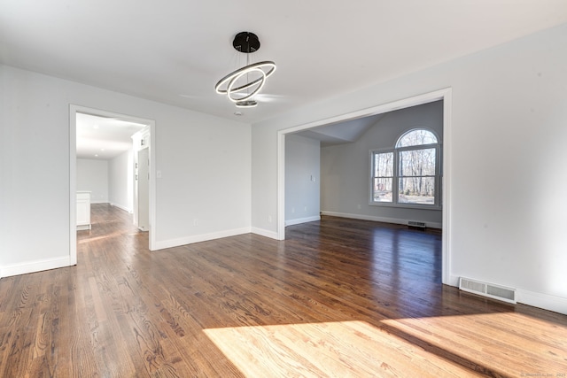 unfurnished dining area featuring dark wood-type flooring