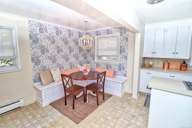 dining room with breakfast area, ornamental molding, and baseboard heating