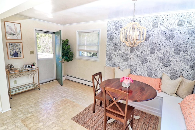 dining room featuring breakfast area, ornamental molding, baseboard heating, and an inviting chandelier