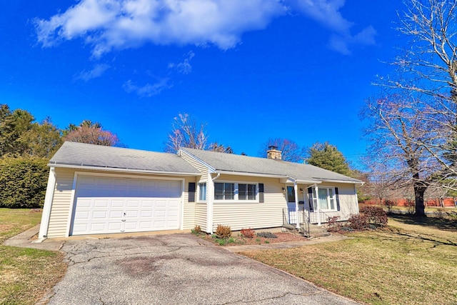 ranch-style home with a garage and a front yard