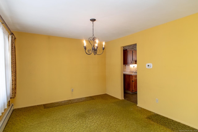 empty room with a baseboard heating unit, dark carpet, and a chandelier