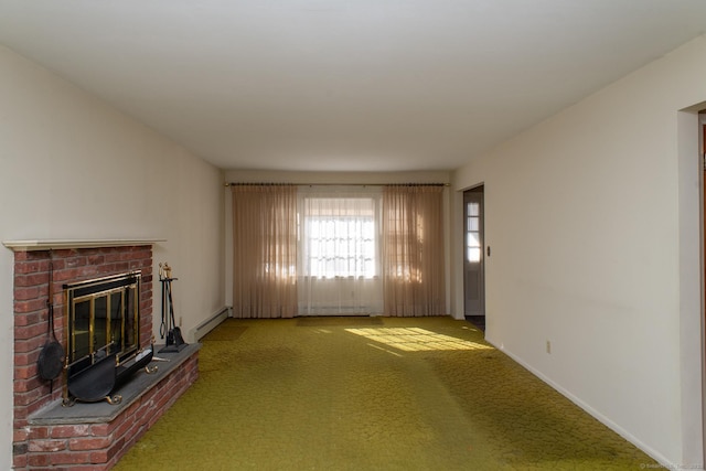 unfurnished living room featuring a brick fireplace, baseboards, a baseboard heating unit, and carpet flooring