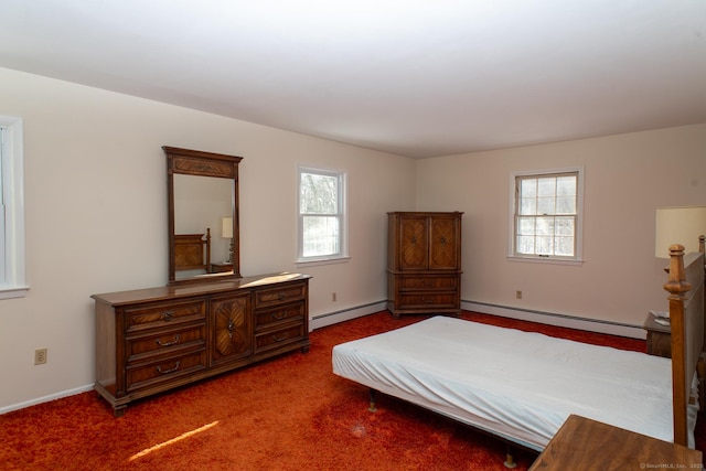 bedroom with multiple windows, a baseboard heating unit, and dark carpet