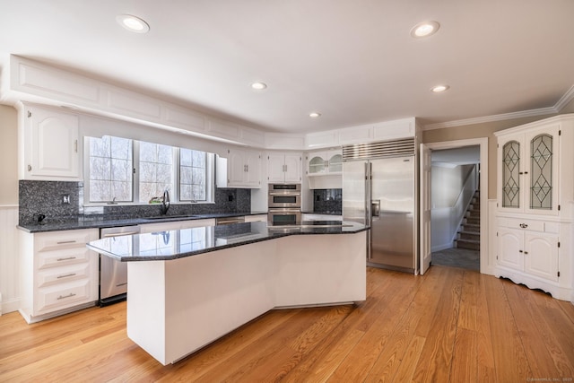 16 Saddle Ridge Rd, New Milford, CT 06776 - kitchen with crown molding, a center island, a sink, white cabinetry, and appliances with stainless steel finishes