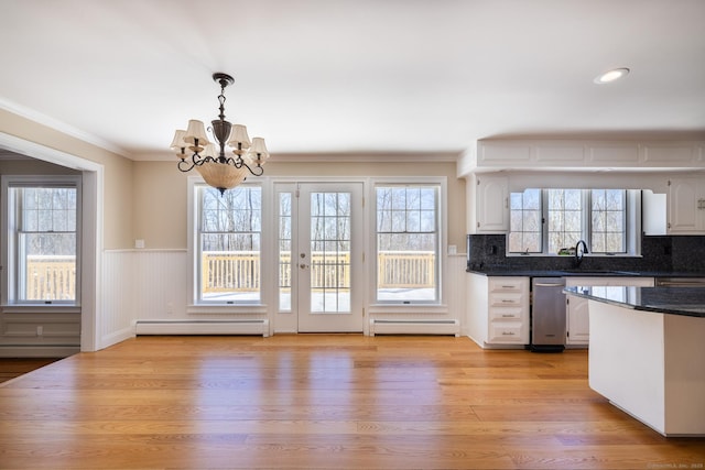 16 Saddle Ridge Rd, New Milford, CT 06776 - kitchen with a chandelier, dark countertops, white cabinets, and baseboard heating