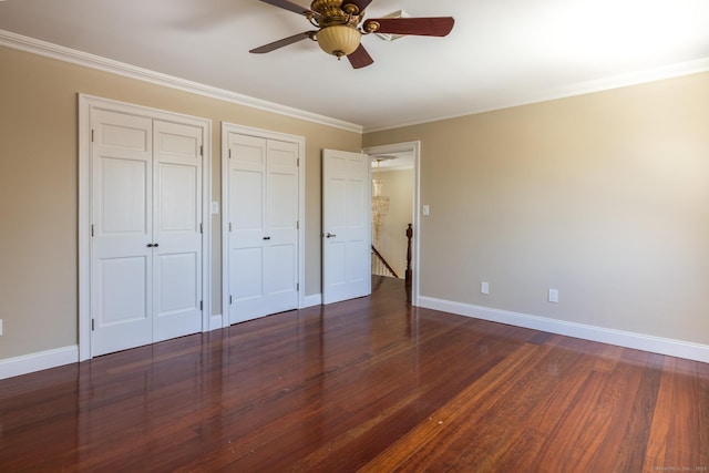 16 Saddle Ridge Rd, New Milford, CT 06776 - unfurnished bedroom featuring two closets, baseboards, and dark wood-style flooring
