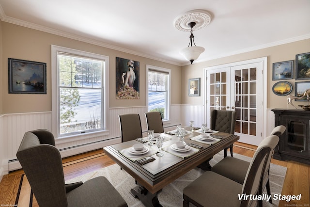 16 Saddle Ridge Rd, New Milford, CT 06776 - dining area featuring a baseboard radiator, crown molding, a wainscoted wall, and french doors