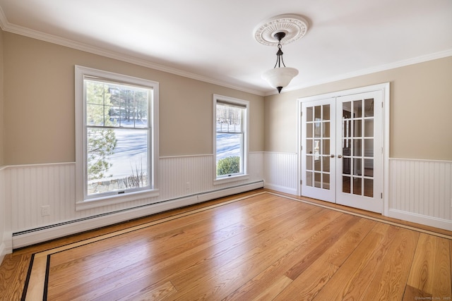 16 Saddle Ridge Rd, New Milford, CT 06776 - spare room with wainscoting, baseboard heating, french doors, and wood finished floors