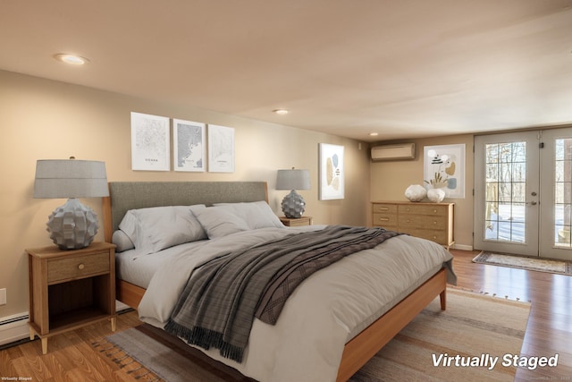 16 Saddle Ridge Rd, New Milford, CT 06776 - bedroom with a baseboard radiator, wood finished floors, a wall mounted AC, access to exterior, and recessed lighting