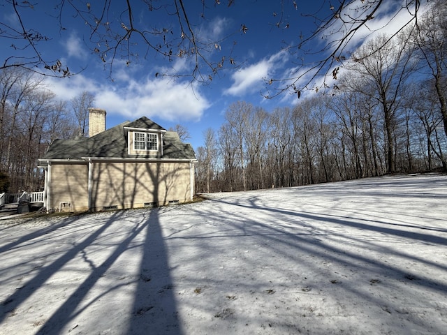 view of yard layered in snow