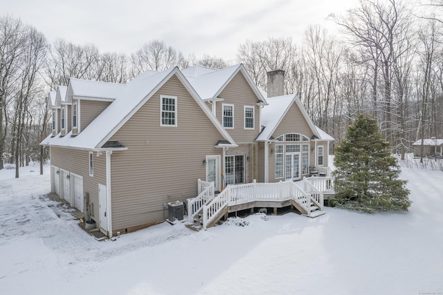 view of front of home with a garage and a deck