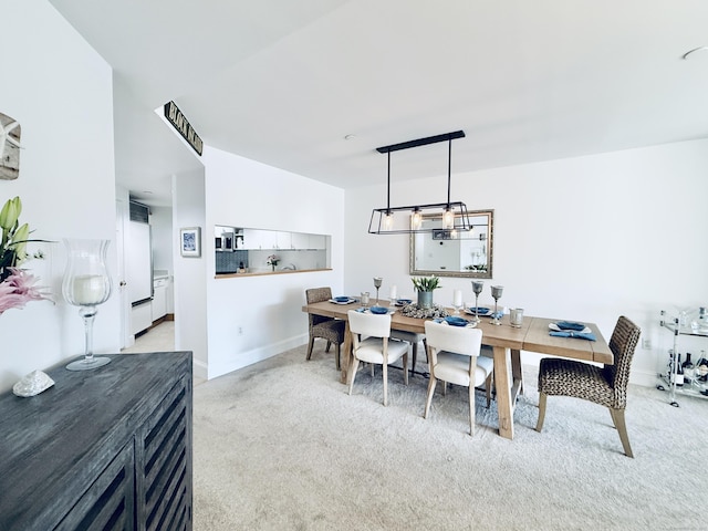 view of carpeted dining space