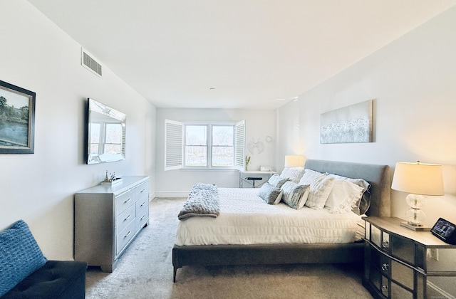 bedroom featuring light carpet